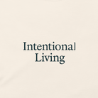 Beige t-shirt with 'Intentional Living' text on a white background