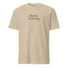 Beige t-shirt with 'Steady & Strong' text on a white background