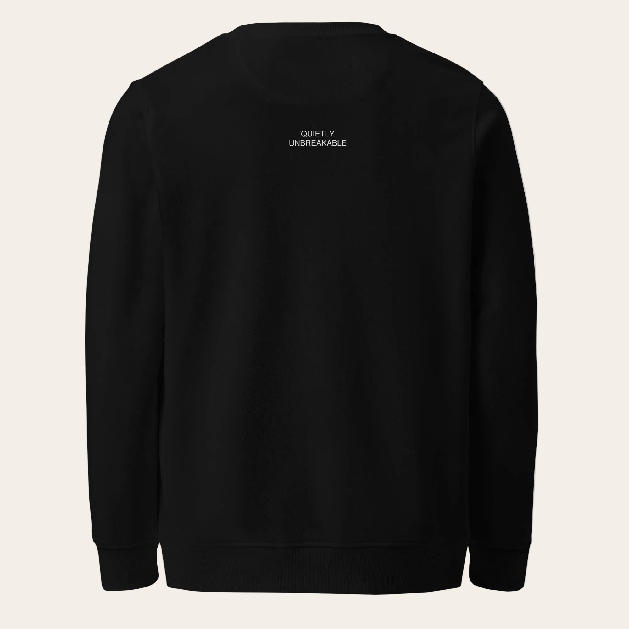 Black hoodie with 'Quietly Unbreakable' text on the back against a white background