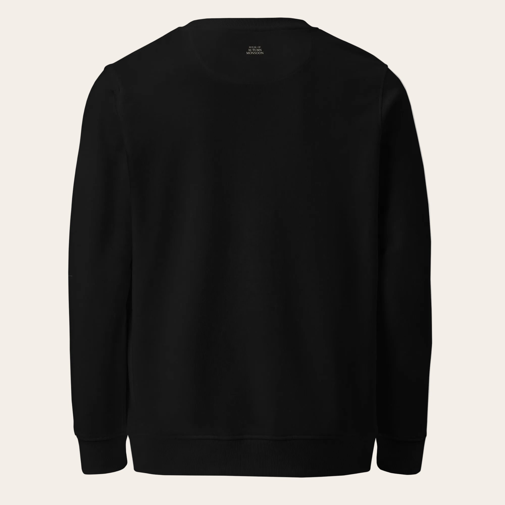 Black sweatshirt with 'root' logo on the back against a white background