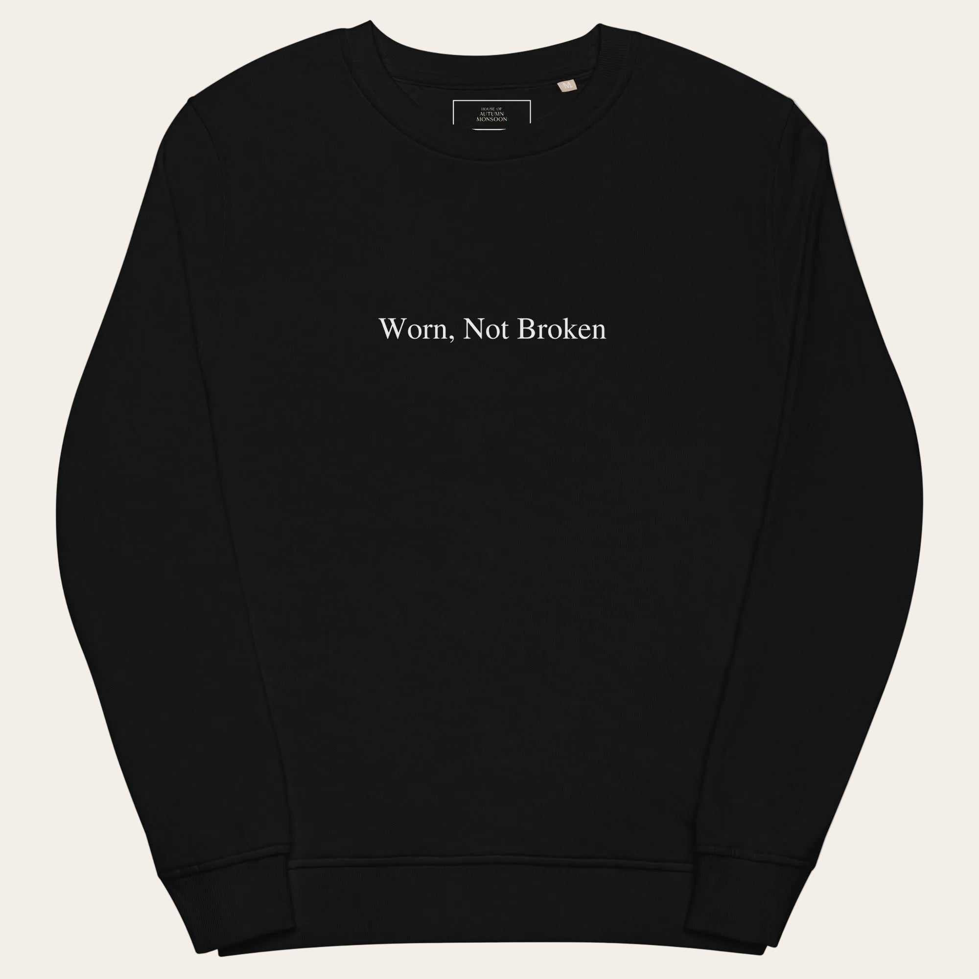 Black sweatshirt with 'Worn, Not Broken' text on a white background
