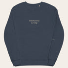Navy blue sweatshirt with 'Intentional Living' text on a white background