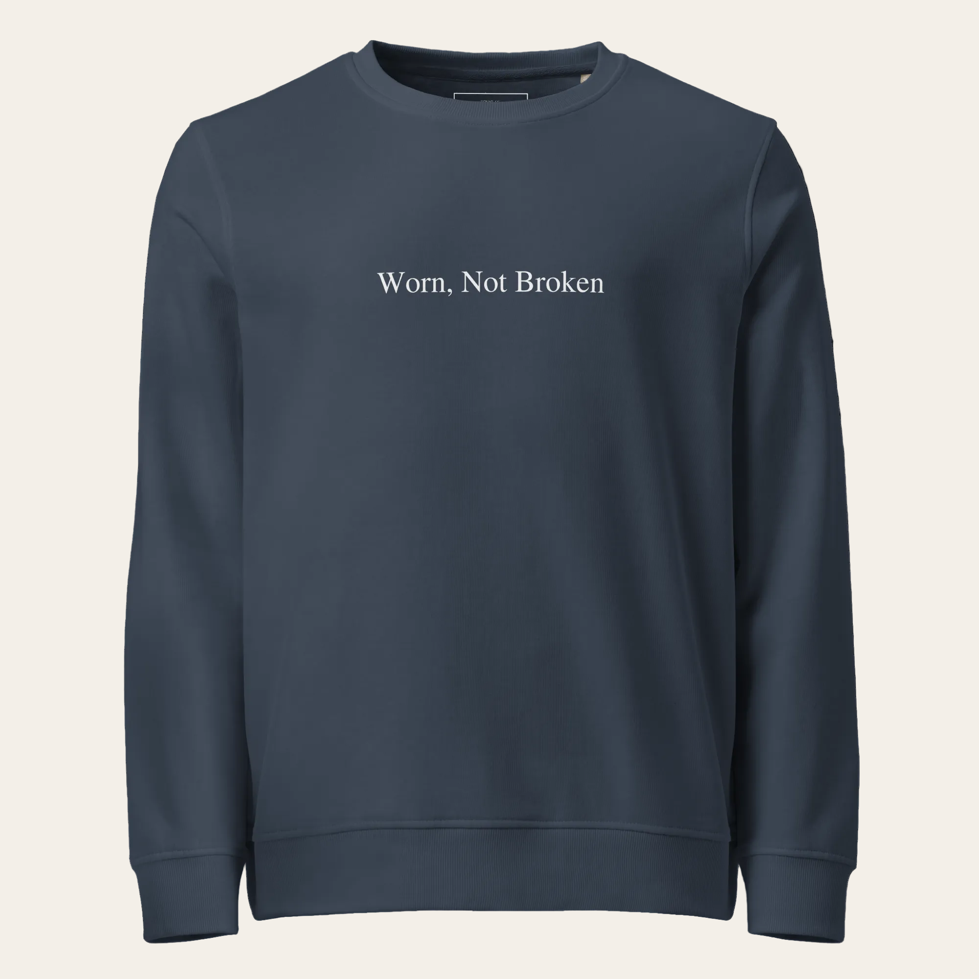 Navy blue sweatshirt with 'Worn, Not Broken' text on a white background
