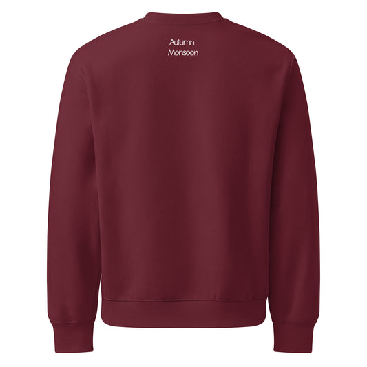 Maroon sweatshirt with 'Autumn Monsoon' text on the back against a white background