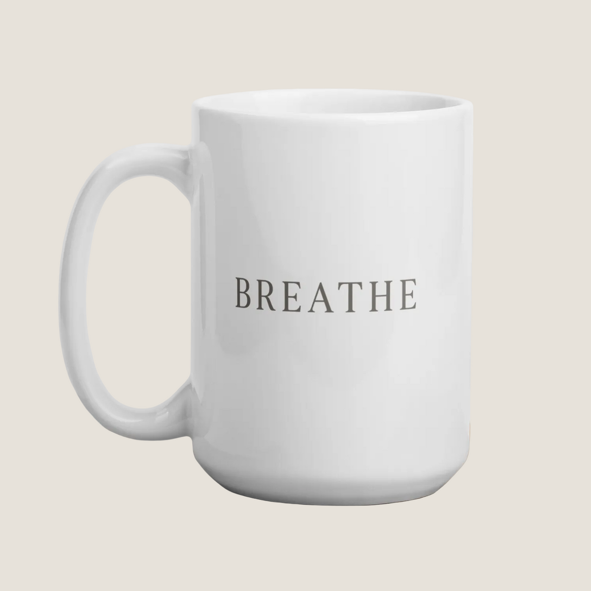 White coffee mug with the word "Breathe"