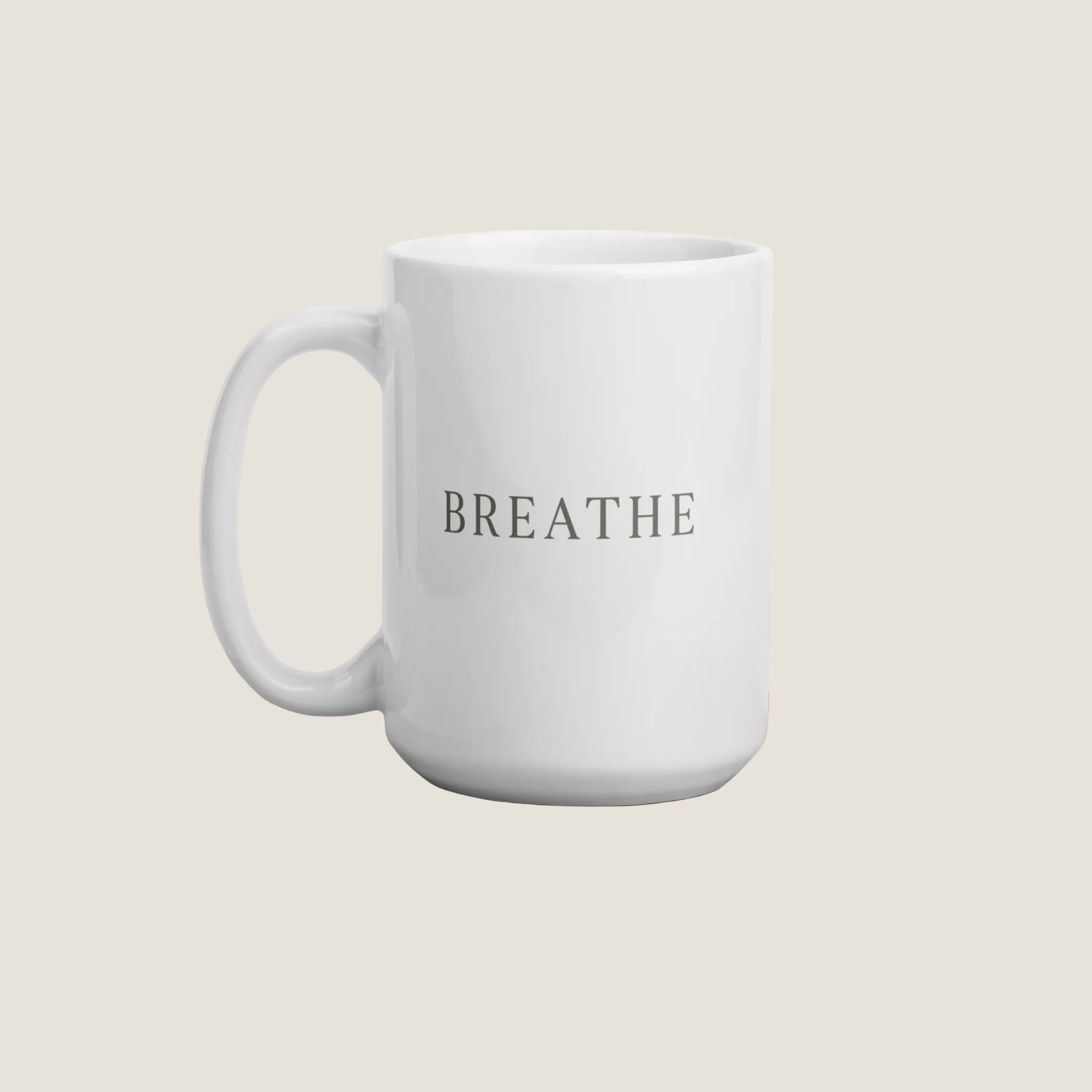 White coffee mug with the word "Breathe"