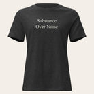 Black t-shirt with white text 'Substance Over Noise.' on a white background