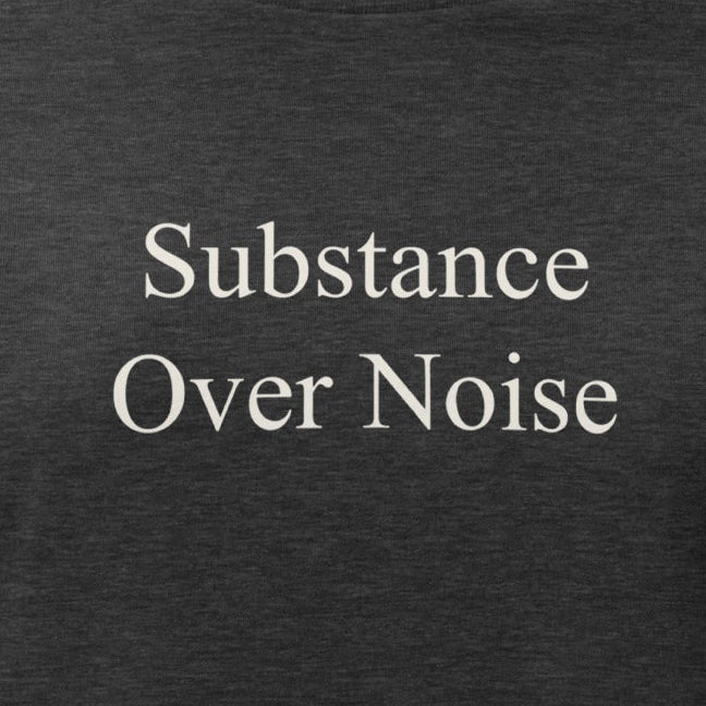 Black t-shirt with white text 'Substance Over Noise .' on a white background